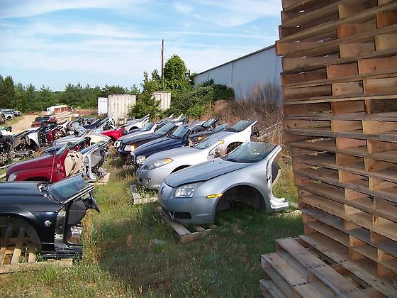 Rows of vehicle parts in the Morrow Motors inventory yard
